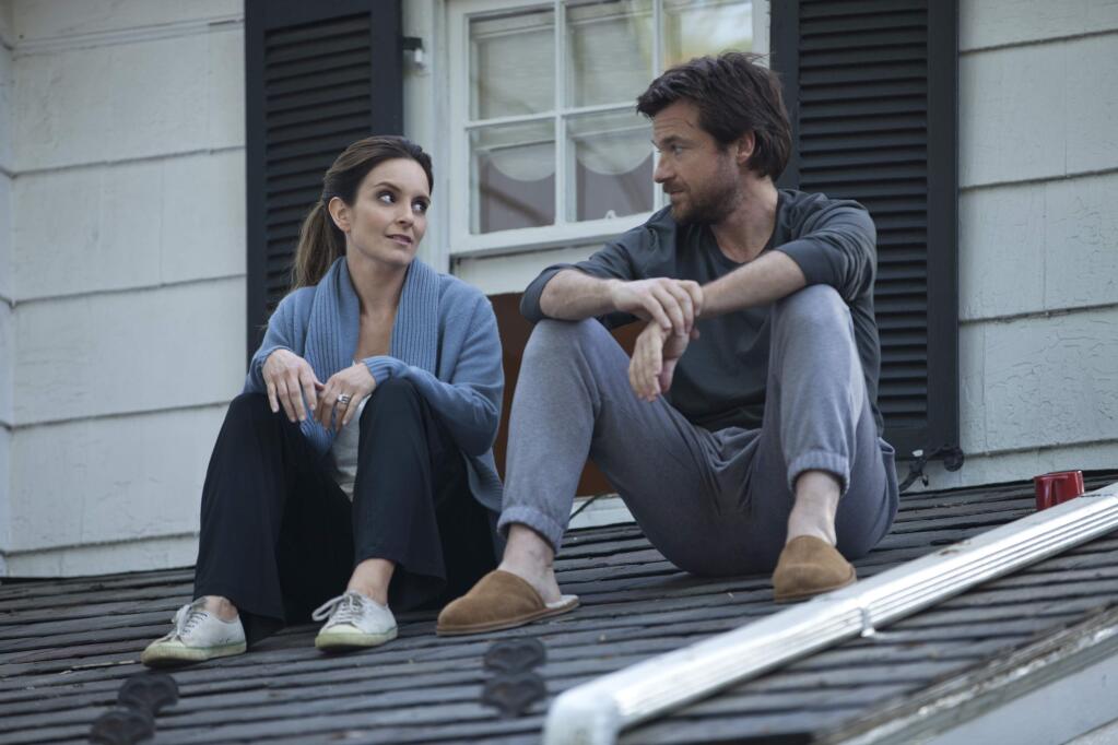 Warner Bros.Jason Bateman as Judd Altman and Tina Fey as Wendy Altman, two of four siblings who reunite at their childhood home after their father dies, all grounded for a week of sitting Shiva (their father's last request) in 'This is Where I Leave You.'