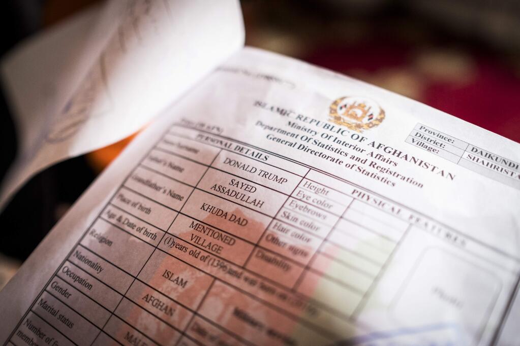 The identification documents of Donald Trump, an Afghan infant, in Kabul, Afghanistan, March 12, 2018. The baby Donald Trump got his name because of his father's admiration for the tycoon and U.S. president, Donald Trump. “When my son was born, his hair was completely blonde, and it matched Trump's hair,” said Sayed Assadullah. “So when I saw his hair, I thought, ‘I will name him Trump.' ” (Jim Huylebroek/The New York Times)