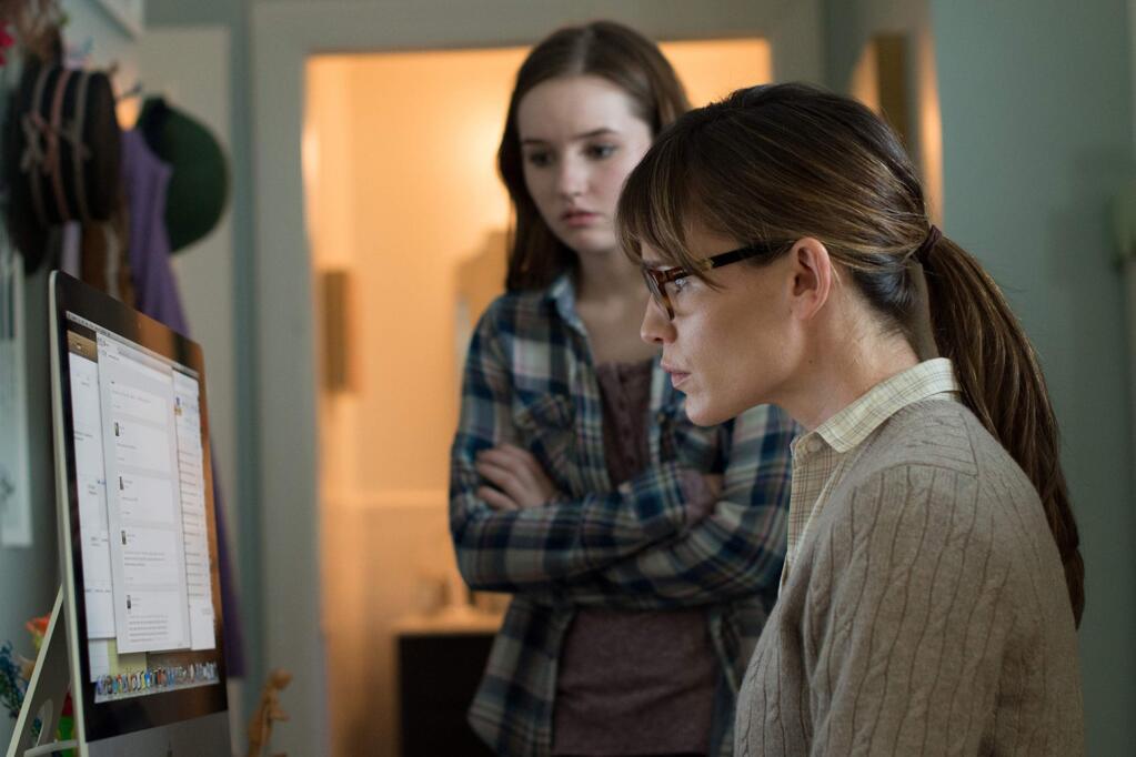 Patricia (Jennifer Garner) desperately tries to track and control the social media activity of her daughter, Brandy (Kaitlyn Dever), in “Men, Women & Children.” (DALE ROBINETTE / Paramount Pictures)