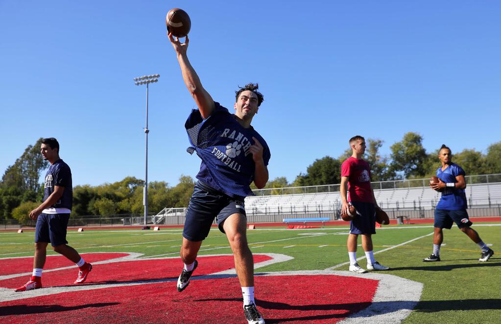 Rancho Cotate quarterback Jake Simmons throws the ball during practice on Thursday in Rohnert Park. (Christopher Chung / The Press Democrat)