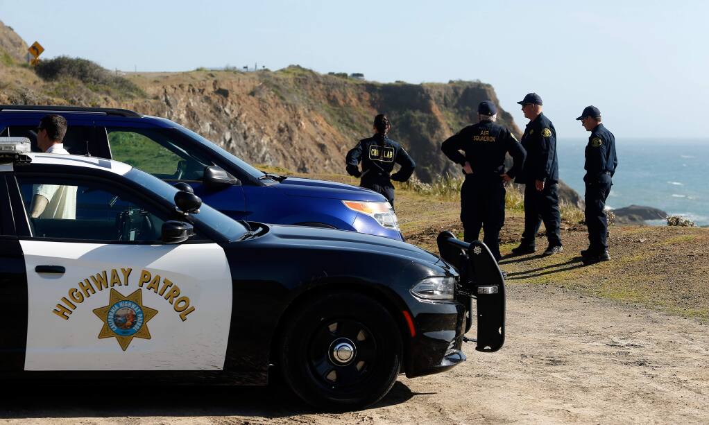California Highway Patrol officers and Alameda County Sheriff deputies and technicians wrap up a search for three missing children, on Wednesday, March 28, 2018, at the site where the bodies of Jennifer Jean Hart, Sarah Margaret Hart and three of their adopted children were recovered two days earlier, after the family's SUV plunged over a cliff at a pullout on Highway 1, near Westport, California. Three of the children, Devonte Hart, 15, Hannah Hart, 16, and Sierra Hart, 12, are still missing. (Alvin Jornada / The Press Democrat)