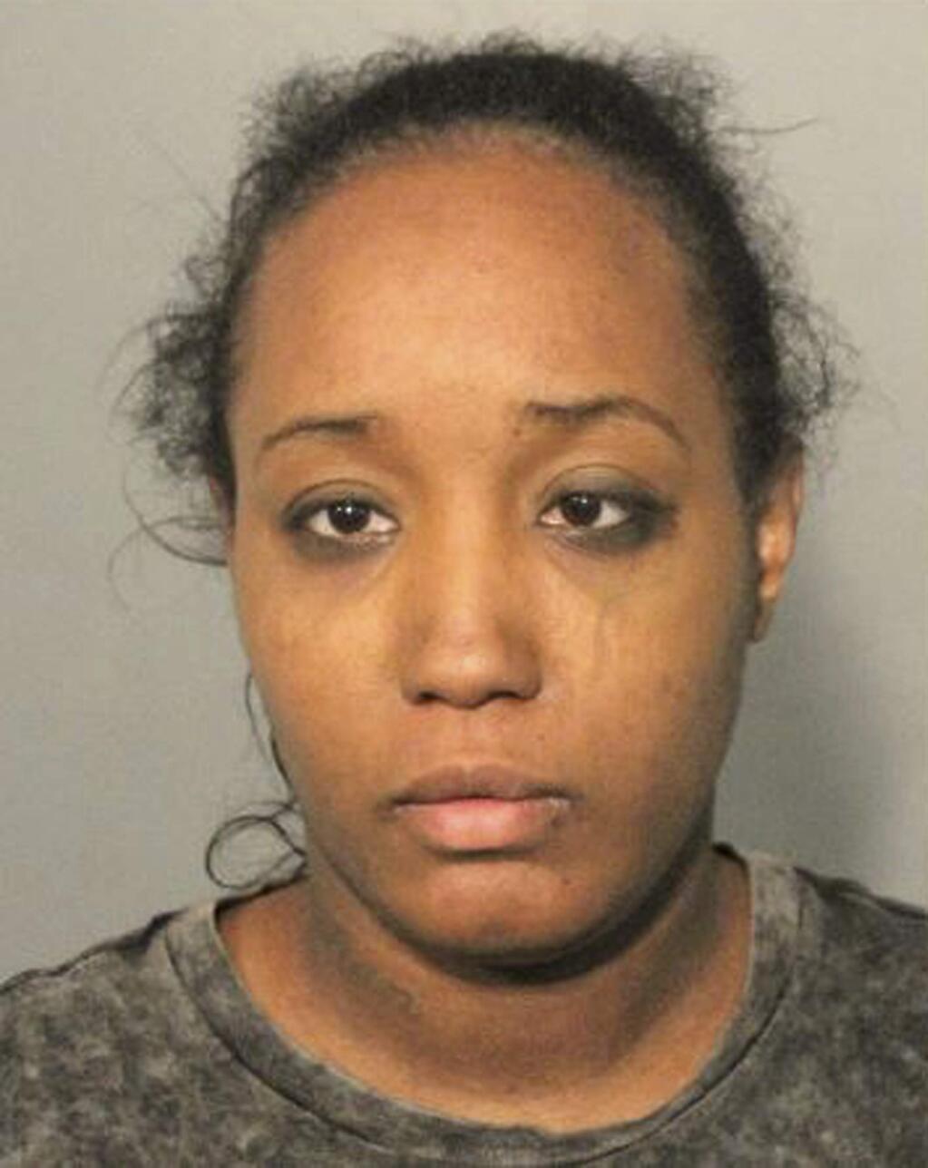 This booking mug released Monday, May 14, 2018, by the Solano County Sheriff's Office shows Ina Rogers. Police said Monday they had removed 10 children from a squalid California home and charged their father with torture and their mother with neglect after an investigation revealed a lengthy period of severe physical and emotional abuse. The children range from 4 months to 12 years old, said Fairfield police Lt. Greg Hurlbut. The father, Jonathan Allen, 29, faces felony charges of torture and child abuse and the 30-year-old mother Ina Rogers faces child neglect charges. She was arrested March 31 and released after posting $10,000 bail. (Solano County Sheriff's Office via AP)