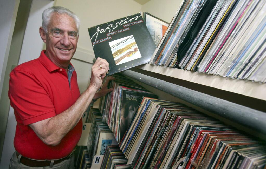 Jim Stern pulls out one of the many records he mixed during his career in the music business in his Petaluma home on Thursday, May 12, 2016. (SCOTT MANCHESTER/ARGUS-COURIER STAFF)