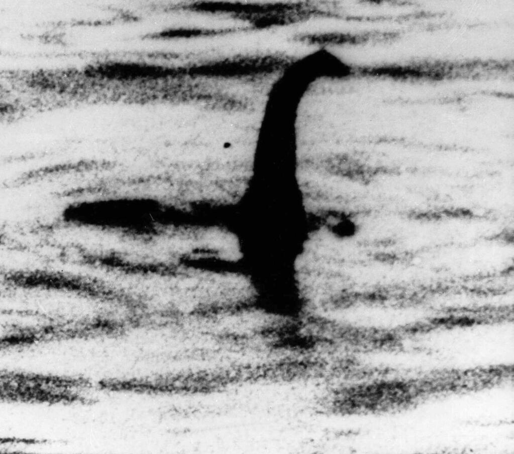 FILE -This is an undated file photo of a shadowy shape that some people say is a photo of the Loch Ness monster in Scotland. For hundreds of years, visitors to Scotland's Loch Ness have described seeing a monster that some believe lives in the depths. Now the legend of 'Nessie' may have no place to hide. Researchers will travel there next month to take samples of the murky waters and use DNA tests to determine what species live there. (AP Photo, File)