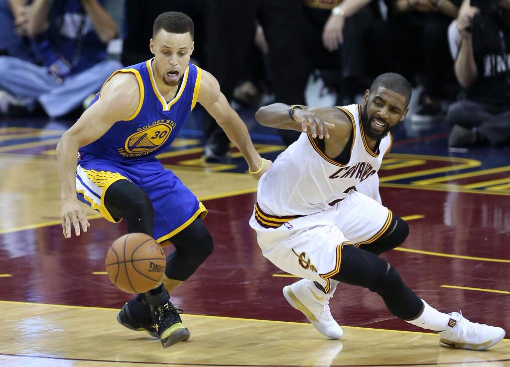 Golden State Warriors' Stephen Curry is called for his fifth foul as he steals the ball from Cleveland Cavaliers' Kyrie Irving, during their game in Cleveland on Thursday, June 16, 2016. The Warriors lost to the Cavaliers 115-101. (Christopher Chung/ The Press Democrat)