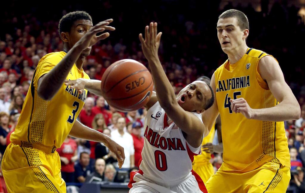 Arizona guard Parker Jackson-Cartwright (0) battles for a loose ball with California guard Tyrone Wallace (3) and David Kravish during the second half of a game, Thursday, March 5, 2015, in Tucson, Ariz. (AP Photo / Rick Scuteri)