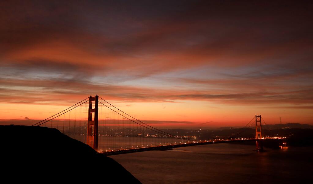 A stunning pre-dawn sunrise over the Golden Gate Bridge, Friday, Jan. 4, 2019, created by high clouds in advance of several winter storms that are due to impact California in the coming days. (Kent Porter / The Press Democrat) 2019