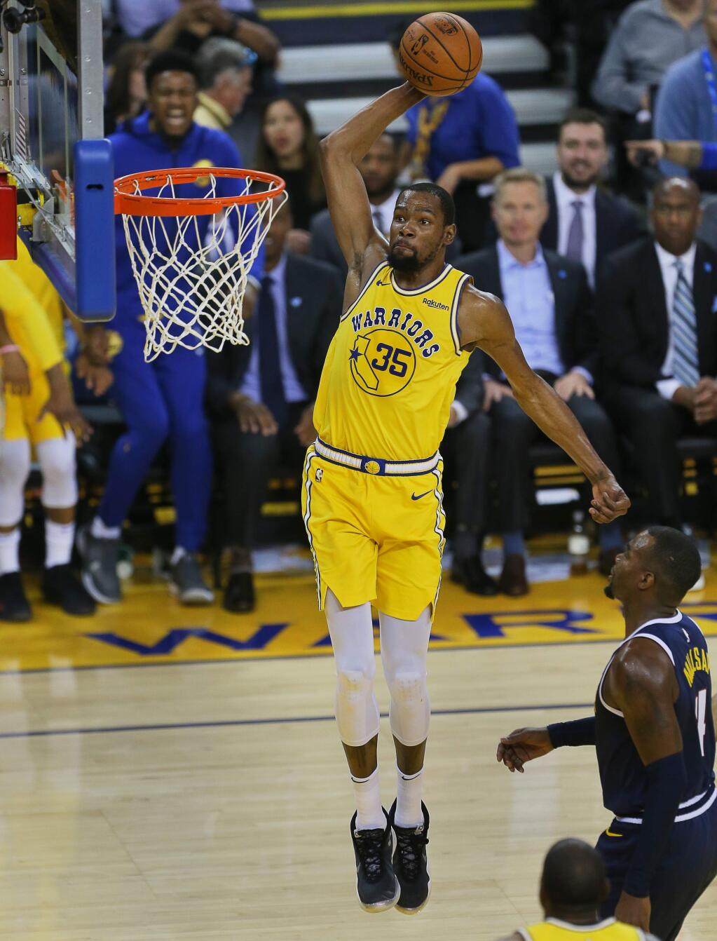 Golden State Warriors forward Kevin Durant dunks the ball against the Denver Nuggets during their game in Oakland on Tuesday, April 2, 2019. (Christopher Chung/ The Press Democrat)