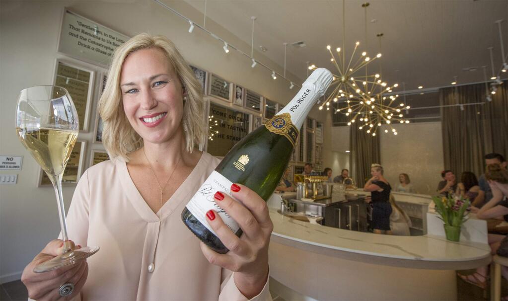 Jayme Powers, proprietor of SIGH, at the newest incarnation of her popular champagne and wine bar on West Napa St. SIGH was originally in the Vine Alley arcade on East Napa St. (Photo by Robbi Pengelly/Index-Tribune)