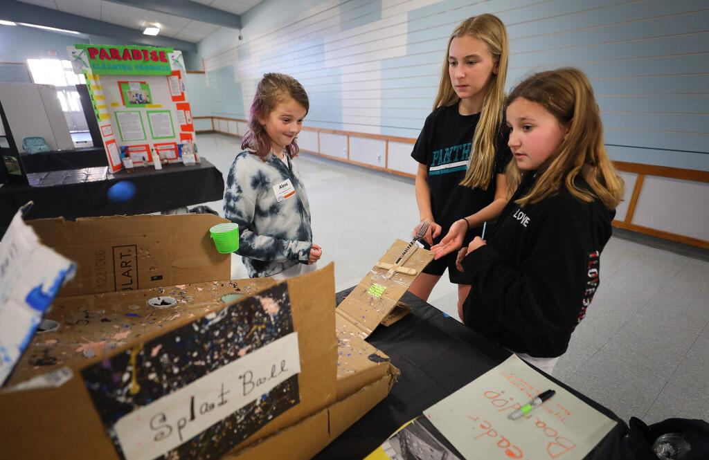 John B. Riebli Elementary School fifth-graders Alexa Pannell, left, Bella Pearson, and Kaleigh Caldwell test their Splat Ball game after setting it up for the Sonoma County Office of Education's annual STEAM Showcase, in Santa Rosa on Thursday, February 27, 2020. (Christopher Chung/ The Press Democrat)