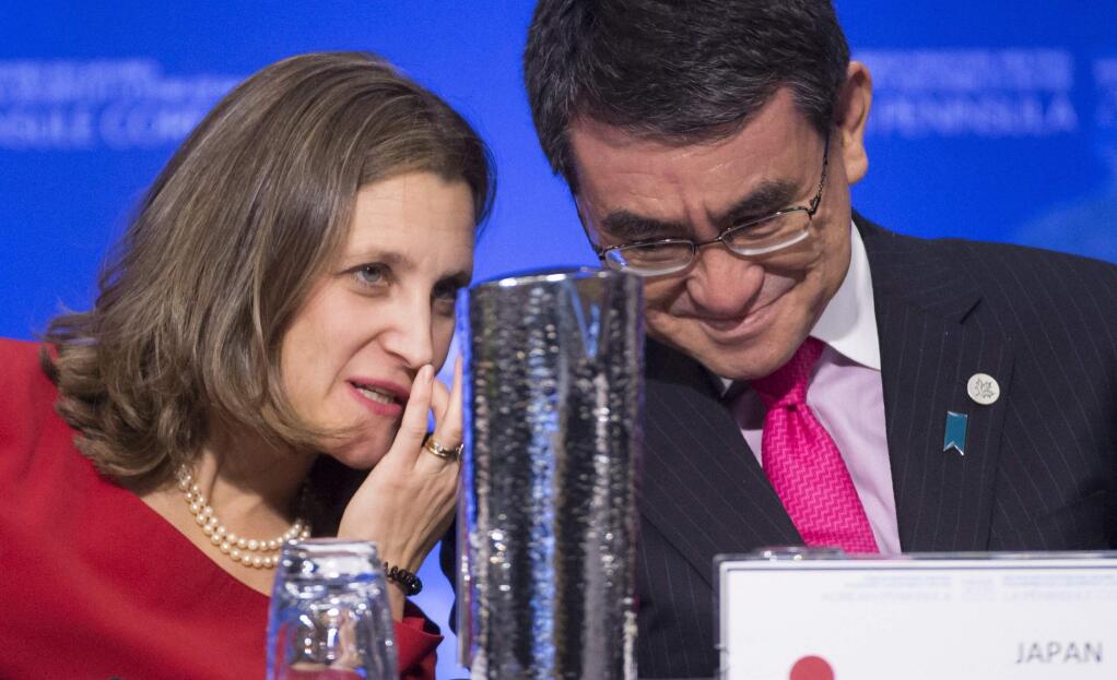 Canadian Minister of Foreign Affairs Chrystia Freeland, left, speaks with Japan's Foreign Affairs Minister Taro Kono during a meeting on North Korea in Vancouver, British Columbia, Tuesday, Jan. 16, 2018. Officials are discussing sanctions, preventing the spread of weapons and diplomatic options. (Jonathan Hayward/The Canadian Press via AP)