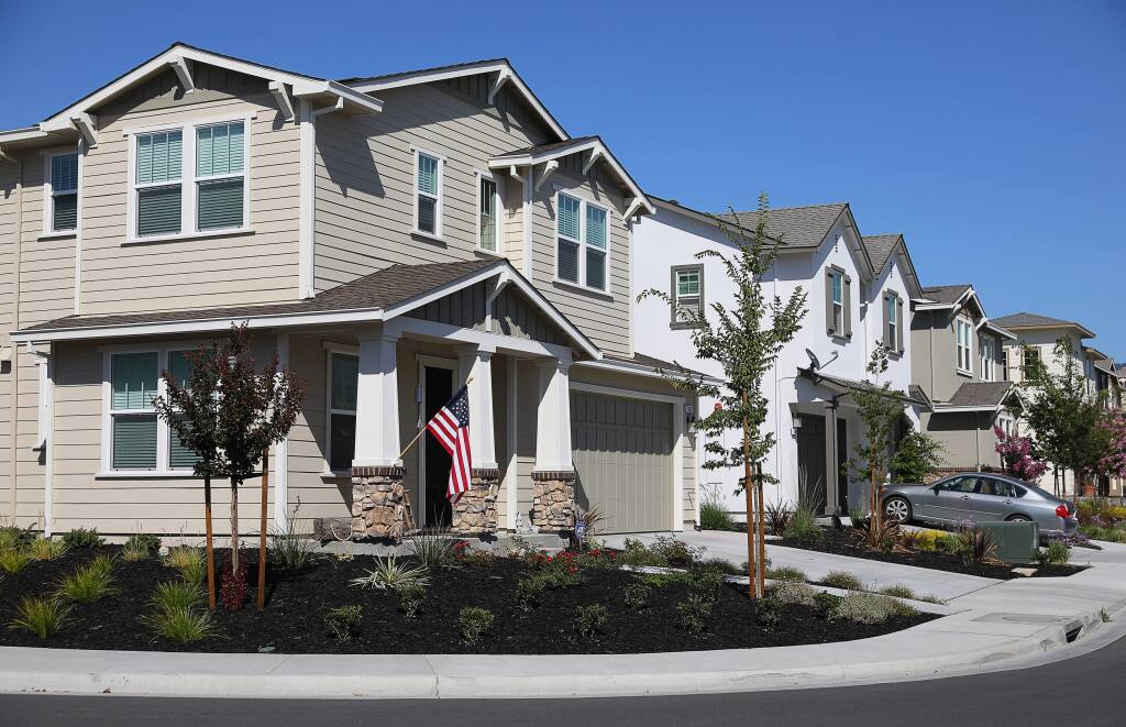 Affordable housing units, such as this duplex on the corner of Winterberry Lane, have been incorporated into the Willowglen subdivision in Rohnert Park.(Christopher Chung/ The Press Democrat)