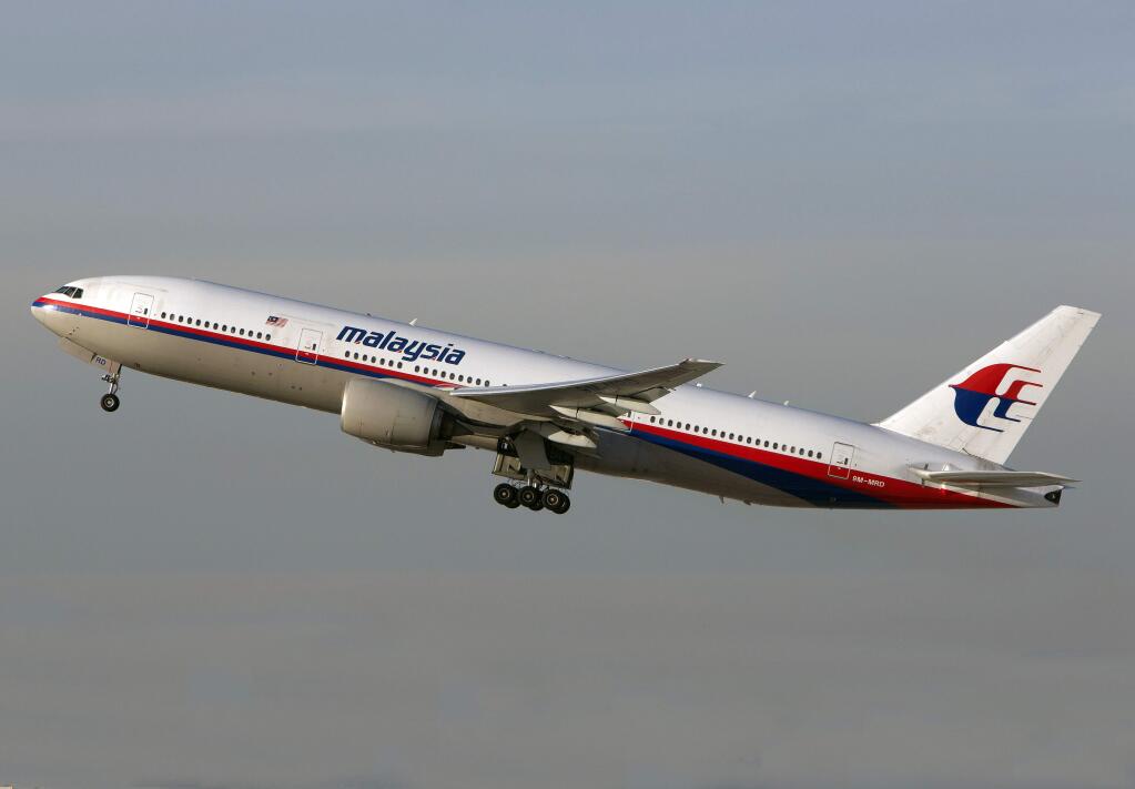 In this Nov. 15, 2012 photo, a Malaysia Airlines Boeing 777-200 takes off from Los Angeles International Airport in Los Angeles. The plane, with the tail number 9M-MRD, is the same aircraft that was heading from Amsterdam to Kuala Lumpur on Thursday, July 17, 2014 when it was shot down near the Ukraine Russia border, according to Anton Gerashenko, an adviser to Ukraine's interior minister. (AP Photo/JoePriesAviation.net)
