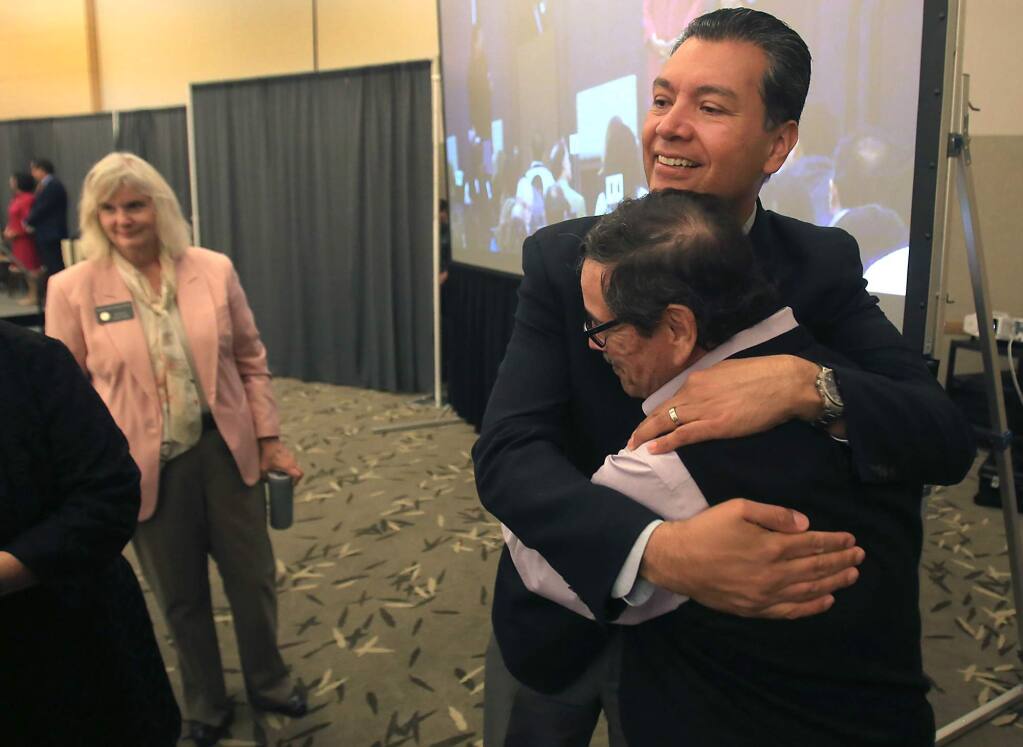 Herman Hernandez, Founder and Chairman of Los Cien, with glasses, greets California Secretary of State Alex Padilla after Padilla gave the keynote address at Los Cien's third State of the Latino Community in Sonoma County, Thursday Sept. 29, 2016 at Sonoma State University in Rohnert Park. At left is Sonoma County Supervisor Susan Gorin. (Kent Porter / Press Democrat) 2016