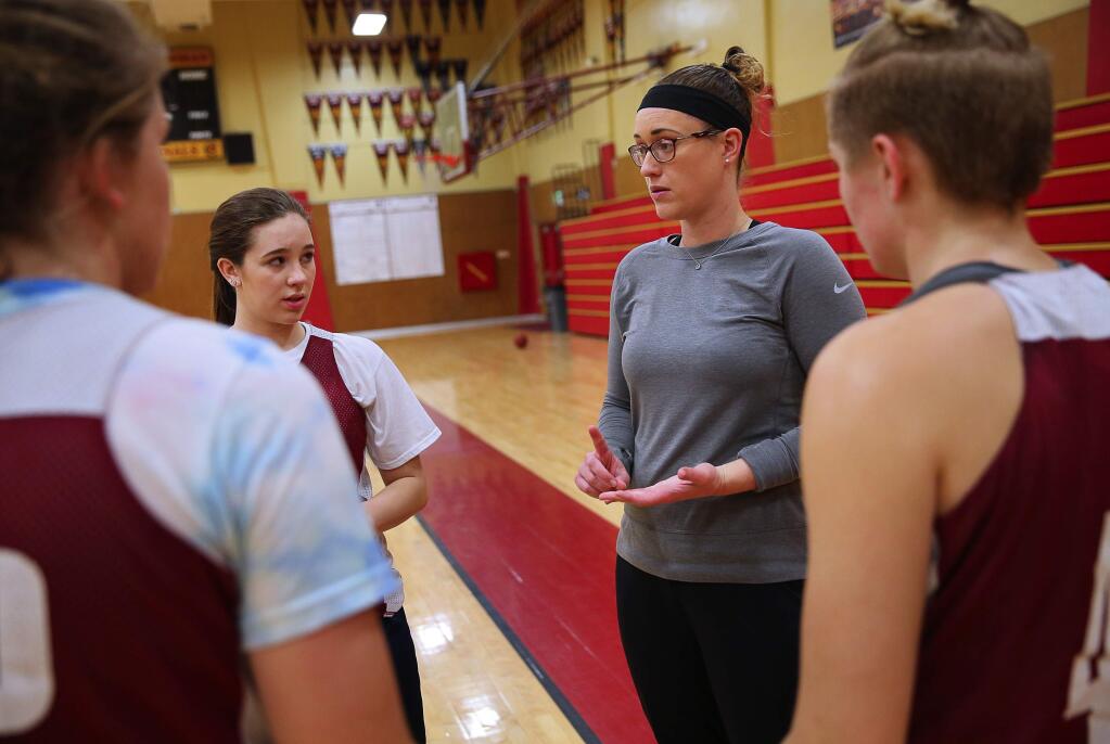 Cardinal Newman girls basketball head coach Monica Mertle gives instructions to her offense during practice in Santa Rosa, on Tuesday, February 23, 2016. (Christopher Chung/ The Press Democrat)
