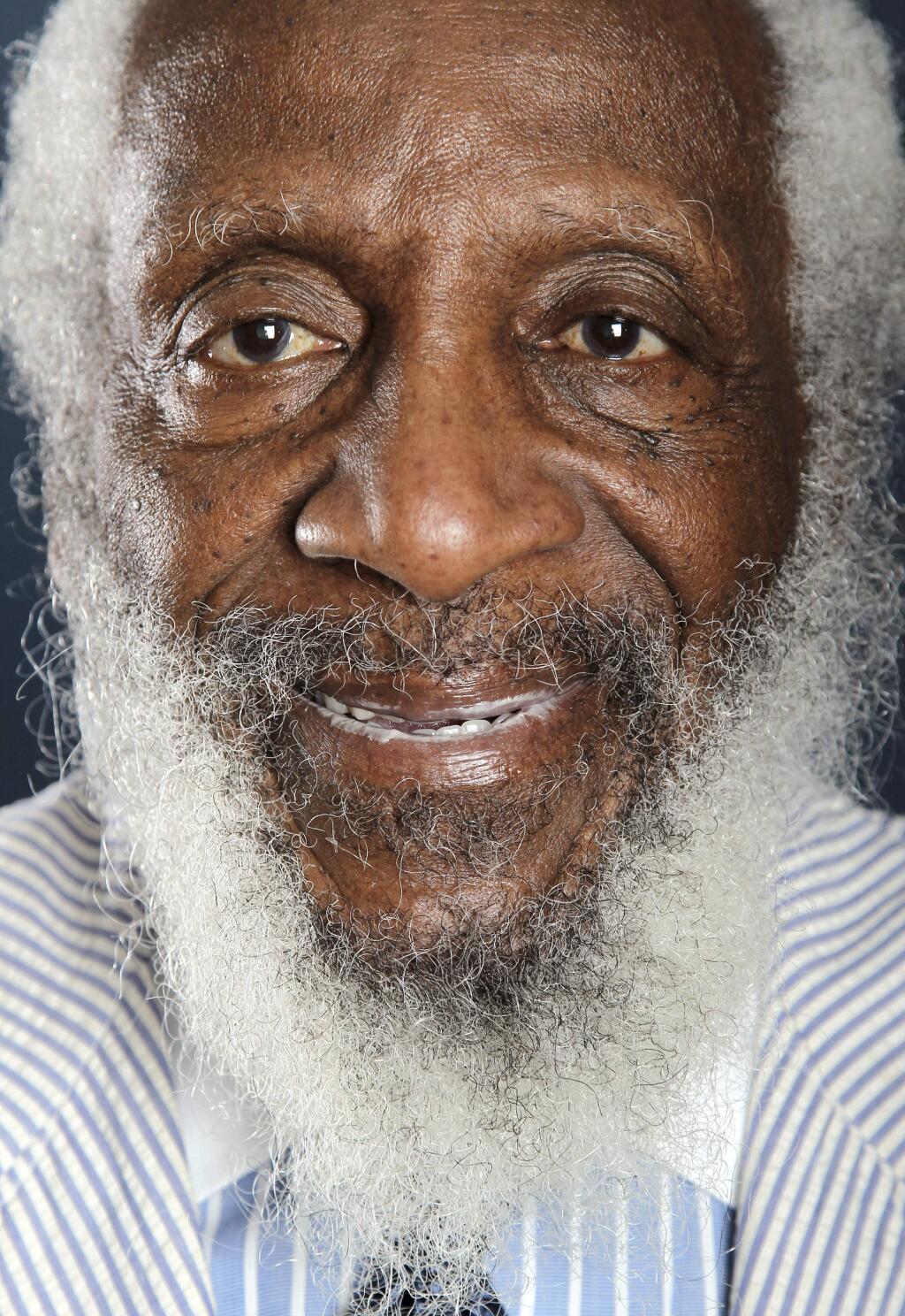 FILE - In this July 21, 2012 file photo, comedian and activist Dick Gregory poses for a portrait during the PBS TCA Press Tour in Beverly Hills, Calif. Gregory, the comedian and activist and who broke racial barriers in the 1960s and used his humor to spread messages of social justice and nutritional health, has died. He was 84. Gregory died late Saturday, Aug. 19, 2017, in Washington, D.C. after being hospitalized for about a week, his son Christian Gregory told The Associated Press. He had suffered a severe bacterial infection. (Photo by Matt Sayles/Invision/AP, File)
