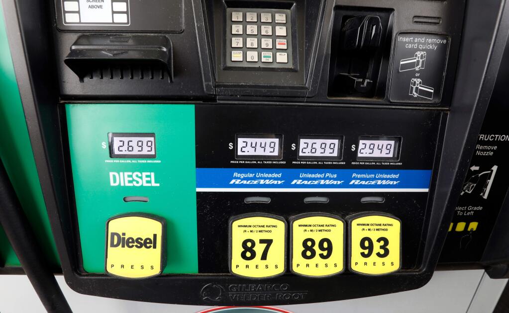 FILE- This April 23, 2018, file photo show gasoline prices at a fueling center in Richland, Miss. Crude oil prices are at the highest level in more than three years and expected to climb higher, pushing up gasoline prices along the way. (AP Photo/Rogelio V. Solis, File)
