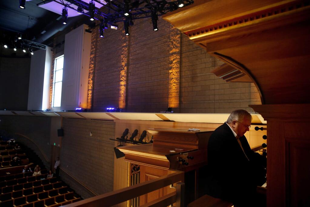 James David Christie performs one of his own compositions on the pipe organ during a media event at the new Schroeder Hall on the Sonoma State University campus in Rohnert Park , California on Monday, August 18, 2014. BETH SCHLANKER/ The Press Democrat)