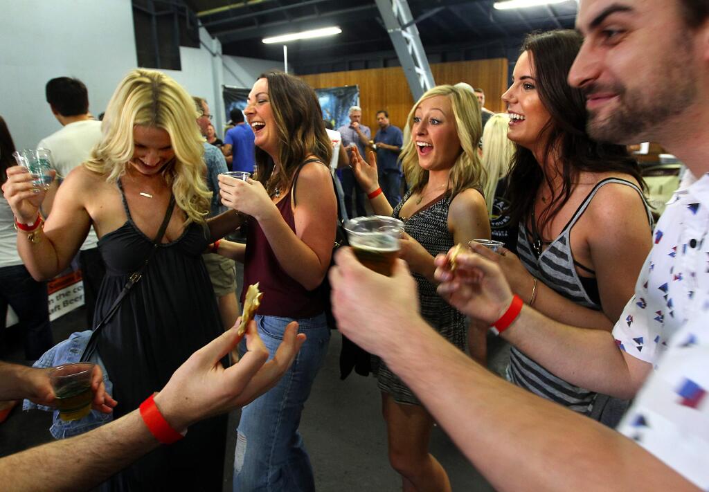 (l to r) Cora McIntyre, Renee Souther, Emily Oyster, Sofia Winters and Bryce Potter enjoy over 70 craft beer brewers and cider makers servingsamples at the Battle of the Brews at the Sonoma County Fairgrounds on Saturday, March 28, 2015. (Photo by John Burgess/The Press Democrat)