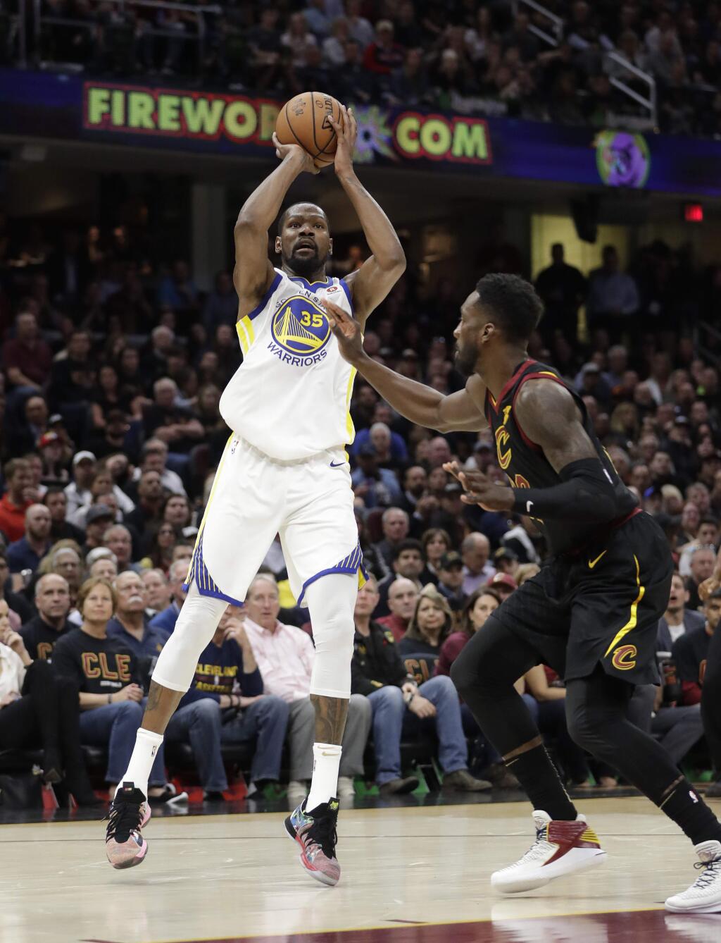 Golden State Warriors' Kevin Durant shoots against Cleveland Cavaliers' Jeff Green during the first half of Game 3 of basketball's NBA Finals, Wednesday, June 6, 2018, in Cleveland. (AP Photo/Tony Dejak)