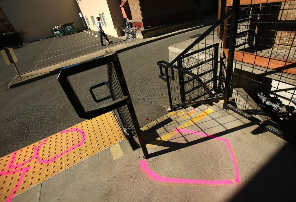 Pink spray paint marks the spot where police found Vladimir Sotelo-Urena, who is on trial for the fatal stabbing of Nicholas Bloom. Bloom was found dead with multiple stab wounds behind the downtown Santa Rosa library on Wednesday, December 25, 2013. (Conner Jay/The Press Democrat)