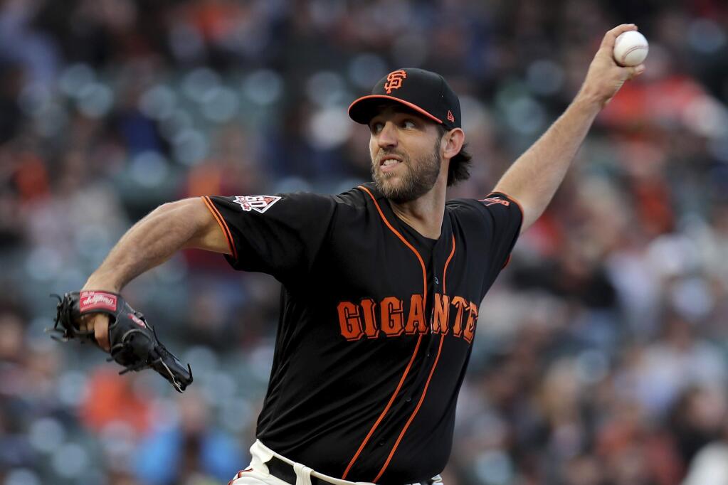 San Francisco Giants starting pitcher Madison Bumgarner throws a pitch in the first inning against the Colorado Rockies in San Francisco, Saturday, Sept. 15, 2018. (AP Photo/Scot Tucker)