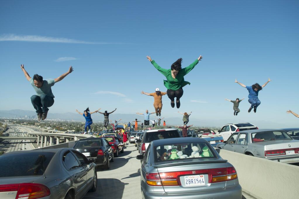 This image released by Lionsgate shows a dance scene from the Oscar-nominated film, 'La La Land.' It's not easy to stage a successful dance scene for the cameras, especially on a highway interchange, but when such a scene works, it can be memorable. (Dale Robinette/Lionsgate via AP)