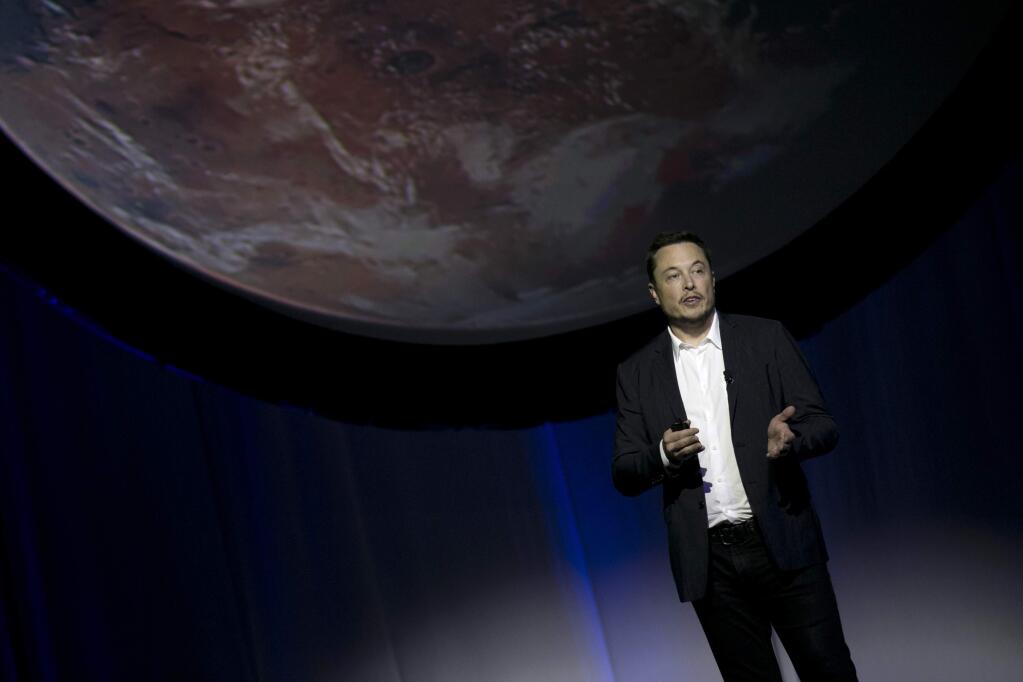 In this Sept. 27, 2016, file photo, SpaceX founder Elon Musk speaks during the 67th International Astronautical Congress in Guadalajara, Mexico. Musk elaborated on his plans to colonize Mars in a Reddit session Sunday, Oct. 23, 2016. (AP Photo/Refugio Ruiz, File)