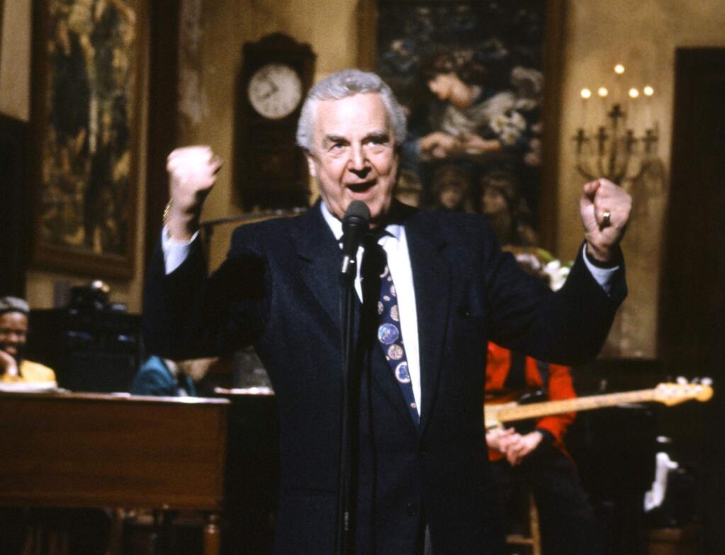 This March 14, 1992 photo provided by NBC shows announcer Don Pardo on the set of 'Saturday Night Live.' Pardo, the durable television and radio announcer whose resonant voice-over style was widely imitated and became the standard in the field, died Monday, Aug. 18, 2014 in Arizona at the age of 96. (AP Photo/NBC, Al Levine)
