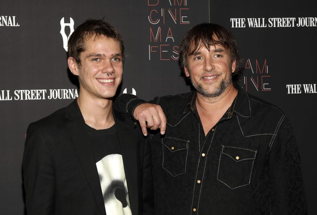 Ellar Coltrane, left, and director Richard Linklater at the premiere of 'Boyhood' at BAMcinemaFest in New York. Coltrane stars in the film, which was filmed over 12 years and told through the eyes of Coltrane's character. (Photo by Andy Kropa/Invision/AP)