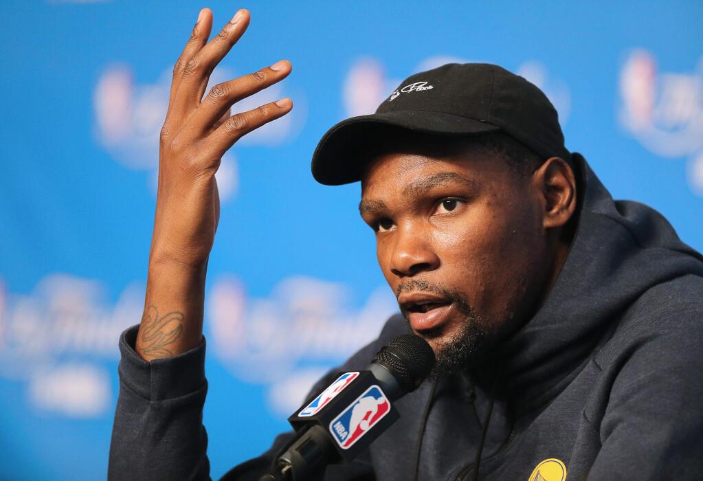 Golden State Warriors forward Kevin Durant answers questions from the media in Cleveland on Thursday, June 8, 2017. (Christopher Chung / The Press Democrat)