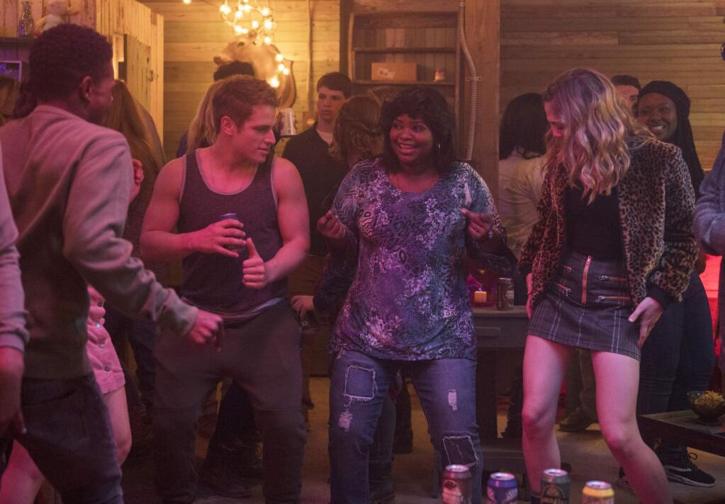 This image released by Universal Pictures shows, from left, Dante Brown, Gianni Paolo, Octavia Spencer and McKaley Miller in a scene from 'Ma.' (Anna Kooris/Universal Pictures via AP)