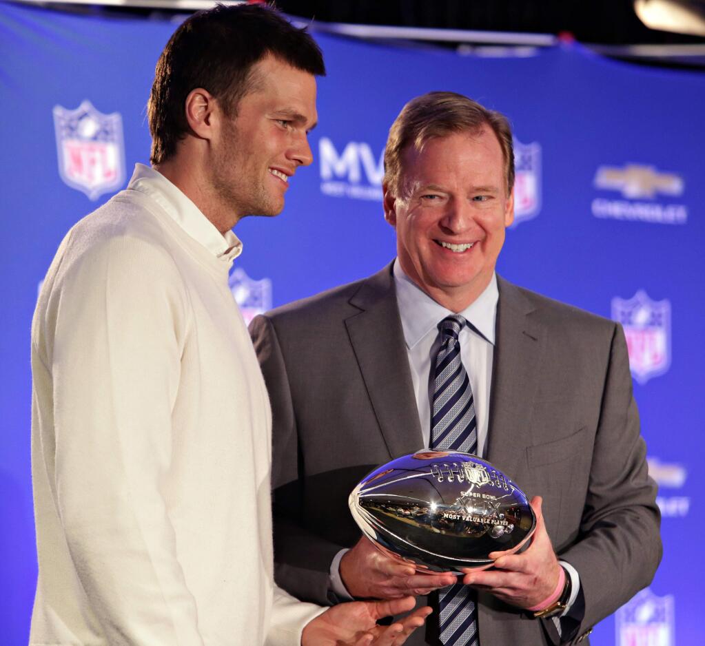 FILE - In this Feb. 2, 2015, file photo, New England Patriots quarterback Tom Brady, left, poses with NFL Commissioner Rodger Goodell during a news conference where Brady was presented the Super Bowl MVP in Phoenix, Ariz. Brady's four-game suspension for his role in using underinflated footballs during the AFC championship game last season has been upheld by Commissioner Goodell. The league announced the decision Tuesday, July 28, 2015. (John Samora/The Arizona Republic via AP, File) MARICOPA COUNTY OUT; MAGS OUT; NO SALES