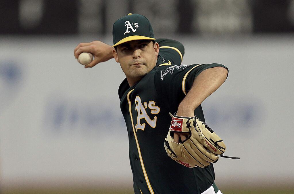 Oakland Athletics pitcher Andrew Triggs works against the Cleveland Indians in the first inning of a baseball game, Monday, Aug. 22, 2016, in Oakland, Calif. (AP Photo/Ben Margot)