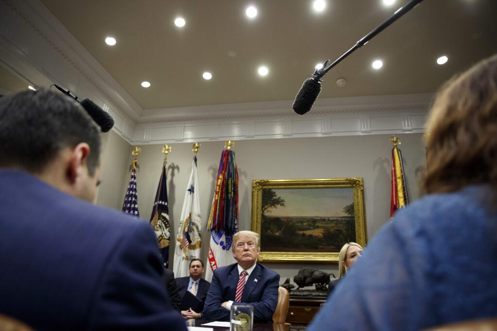 President Donald Trump listens during a meeting with state and local officials to discuss school safety in the Roosevelt Room of the White House, Thursday, Feb. 22, 2018, in Washington. (AP Photo/Evan Vucci)