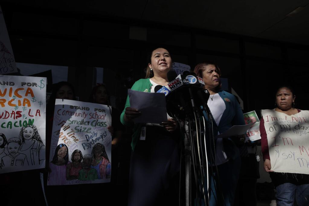 Gloria Martinez, vice president of United Teachers Los Angeles, speaks during a news conference outside the Los Angeles Unified School District headquarters Wednesday, Jan. 9, 2019, in Los Angeles, Calif. The union representing teachers in Los Angeles has postponed the start of a possible strike until Monday because of uncertainty over whether a judge would order a delay. (AP Photo/Jae C. Hong)