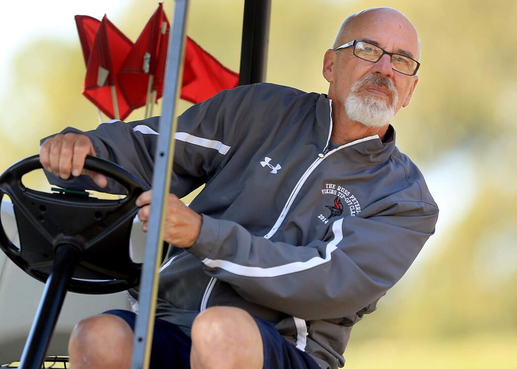 Ex Montgomery High School basketball coach Tom Fitchie came out of retirement to coach the girls golf program. On Tuesday Sept. 13, 2016 he watches a shot by one of his golfers at Bennett Valley Golf Course in Santa Rosa. (Kent Porter / The Press Democrat) 2016