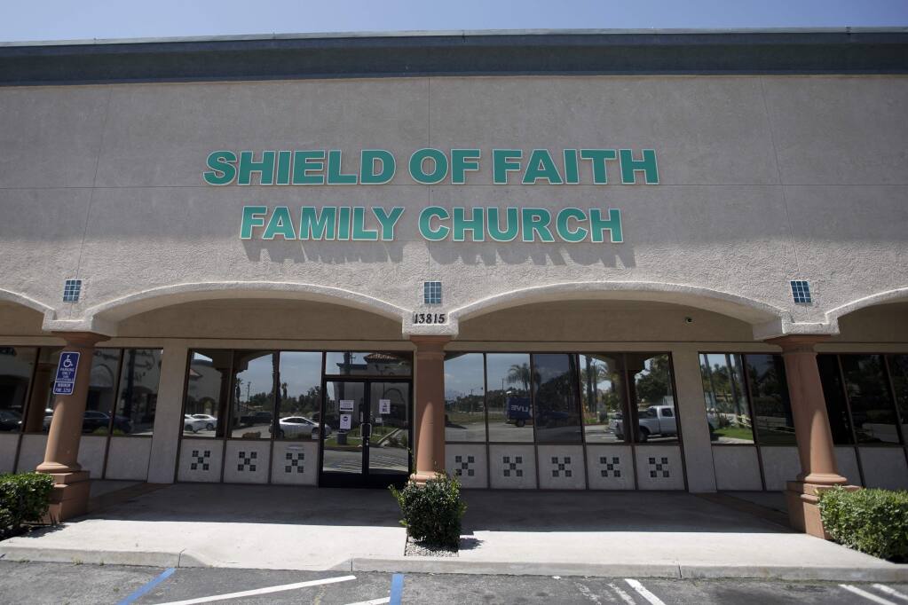 FILE - In this April 14, 2020, file photo, Shield of Faith Family Church stands in Fontana, Calif. A federal judge on Wednesday, April 22, said he will deny a bid by three Southern California churches, including Shield of Faith Family Church, to hold in-person church services during the coronavirus pandemic, saying that government's emergency powers trump what in normal times would be fundamental constitutional rights. (AP Photo/Chris Carlson, File)