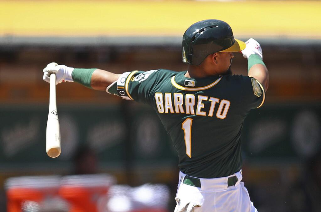 The Oakland Athletics' Franklin Barreto swings for a two-run double off the Toronto Blue Jays' Danny Barnes in the sixth inning, Wednesday, Aug. 1, 2018, in Oakland. (AP Photo/Ben Margot)