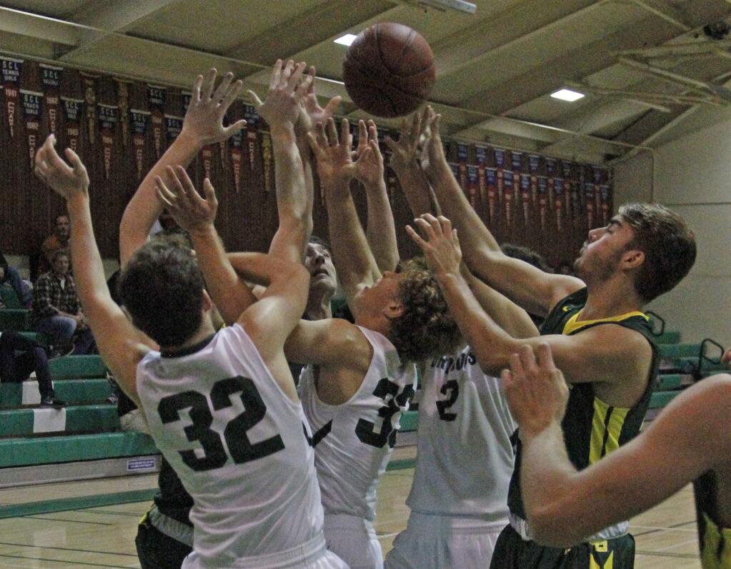 Bill Hoban/Index-TribuneSonoma's Nick Spanger (#32), Kahlil Villas Martinis (33) and Tyler Garrett (#2) join the scrum Tuesday night reaching for a rebound. The Dragons plaed Casa Grande in the annual Foundation Game.