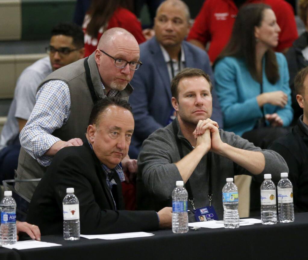 Cleveland Cavaliers general manager David Griffin, top left, Chicago Bulls general manager Gar Forman, bottom left, and Bulls head coach Fred Hoiberg watch draft prospects at the NBA basketball combine Friday, May 12, 2017, in Chicago. (AP Photo/Charles Rex Arbogast)