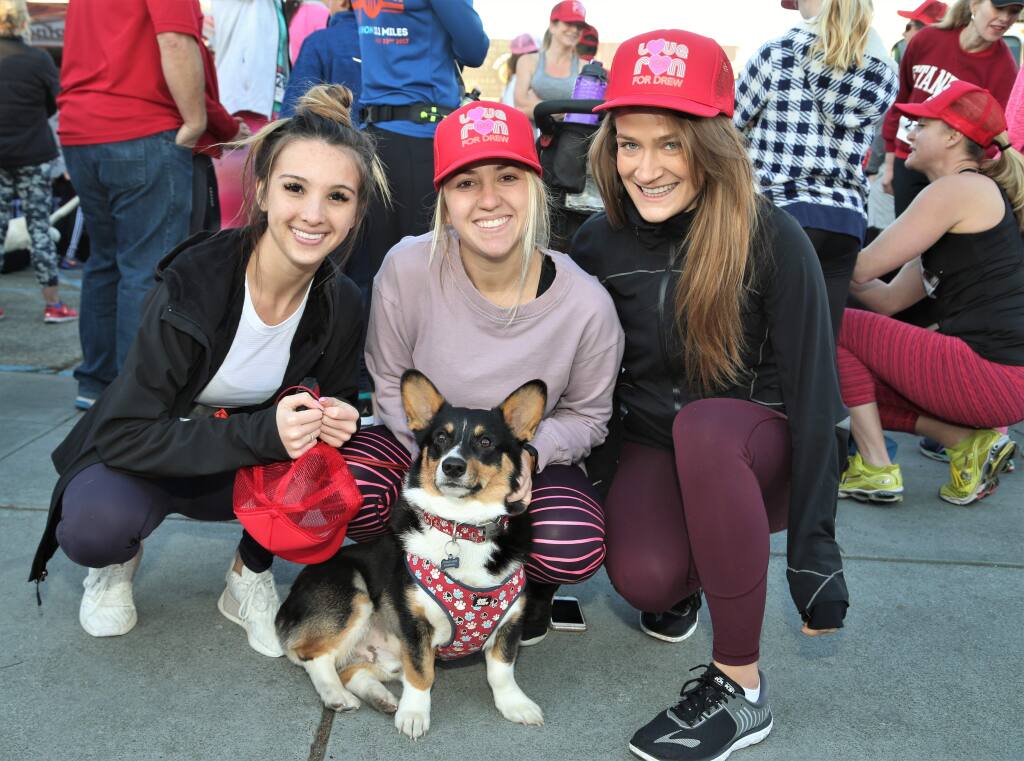 From left, Kamran Heth, Chelsea Macri, Mehgan Holt and Winston at the start line of the 5K run. Hundreds of runners came to Healdsburg Saturday, February 10th, 2018 to participate in the 'Love Run for Drew'. The 5K run organized by the Healdsburg Running Company benefits the Drew Esquivel Memorial Scholarship which helps kids attend college. (Photos Will Bucquoy/for the Press Democrat)