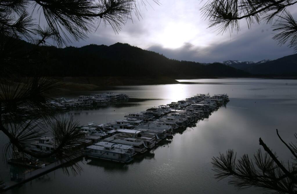FILE - In this Feb. 22, 2008, file photo, boats are seen docked on Lake Shasta, Calif. The National Forest Service says workers cleaned up half-mile wide swath of trash on May 25, 2016, left behind by about 1,000 campers following an annual trip to the lake by fraternity and sorority members last weekend. (AP Photo/Rich Pedroncelli, File)
