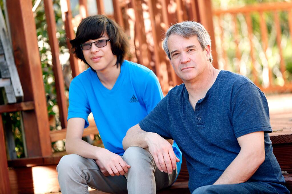 Richard Lazovick, right, and his son Joshua, 15, at their home in Santa Rosa, California, on Saturday, March 11, 2017. (Alvin Jornada / The Press Democrat)