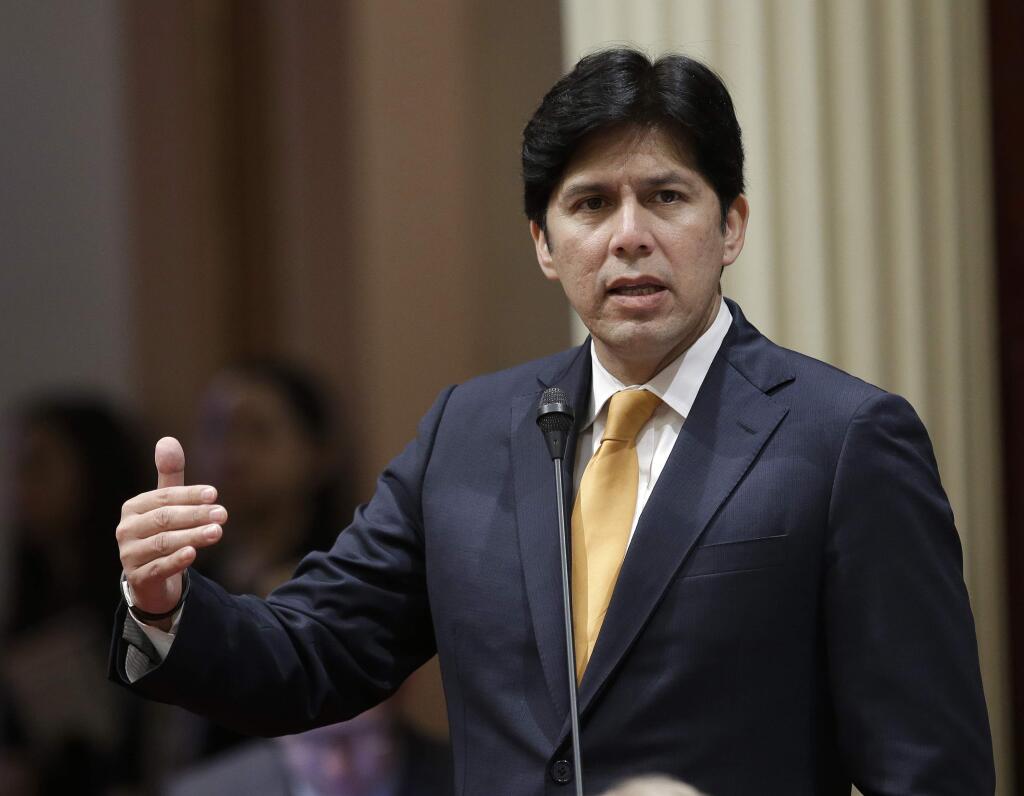FILE-- In this May 19, 2016 file photo, State Senate President Pro Tem Kevin de Leon, D-Los Angeles, addresses the Senate in Sacramento, Calif. Vowing to protect California's values and constitutional guarantees, the state Legislature has selected former U.S. Attorney General Eric Holder to serve as outside counsel to advise the legal strategy against the Trump administration. De Leon and Assembly Speaker Anthony Rendon announced Wednesday, Jan. 4, that Holder will help legislators resist any attempts to roll back progress on issues like climate change, health care, civil rights and immigration.(AP Photo/Rich Pedroncelli, File)