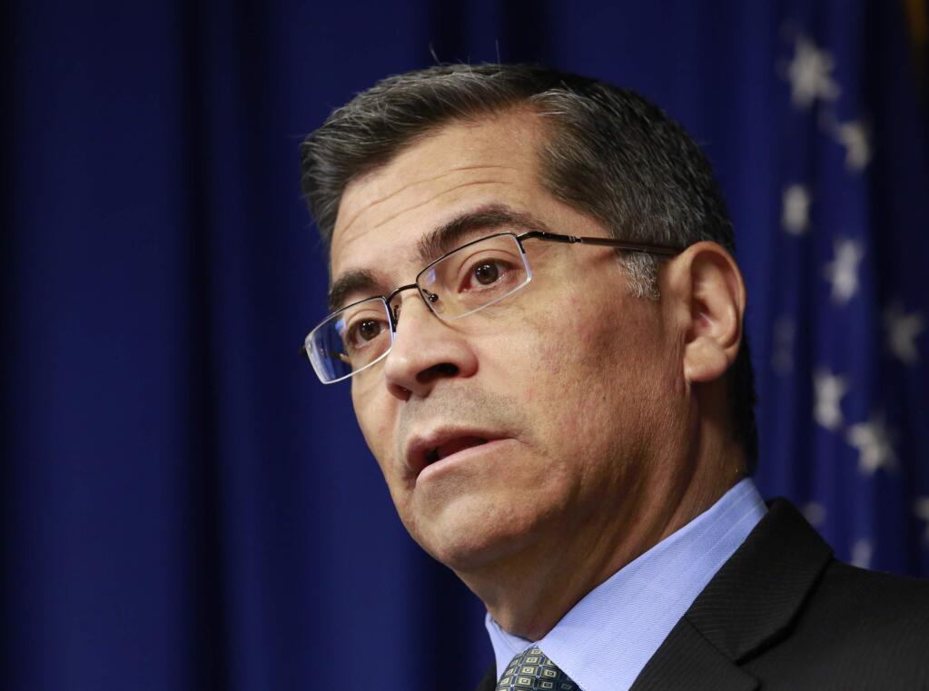 File - In this Feb. 20, 2018, file photo, California Attorney General Xavier Becerra speaks at a news conference in Sacramento, Calif. California's attorney general is asking an appeals court to quickly block a judge's decision to toss a 2016 state law allowing the terminally ill to end their lives. Becerra on Monday, May 21, 2018, requested an immediate stay and the reversal of a judge's ruling last week that the law was unconstitutionally approved by the state legislature. (AP Photo/Rich Pedroncelli, File)