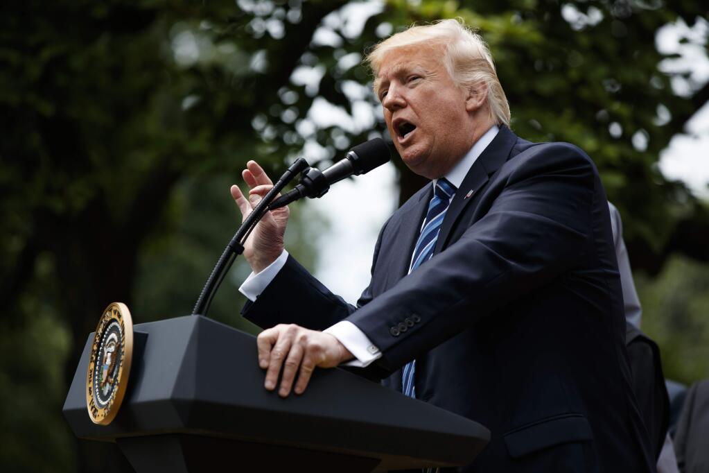 President Donald Trump speaks in the Rose Garden of the White House in Washington, Thursday, May 4, 2017, before he signed an executive order aimed at easing an IRS rule limiting political activity for churches. (AP Photo/Evan Vucci)