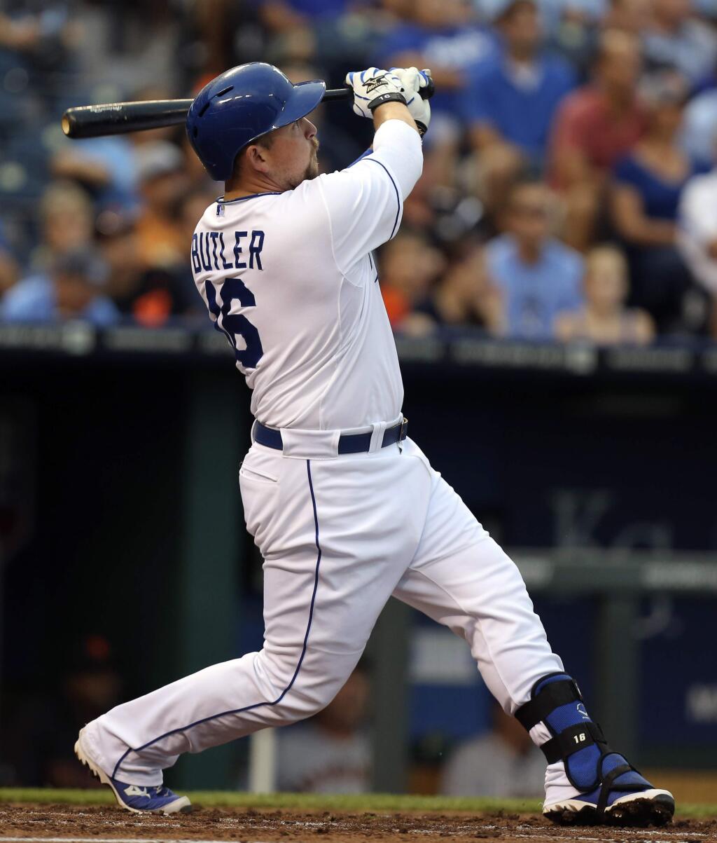 Kansas City Royals' Billy Butler hits a two-run home run in the first inning during a baseball game against the San Francisco Giants, Friday, Aug. 8, 2014, in Kansas City, Mo. (AP Photo/Ed Zurga)