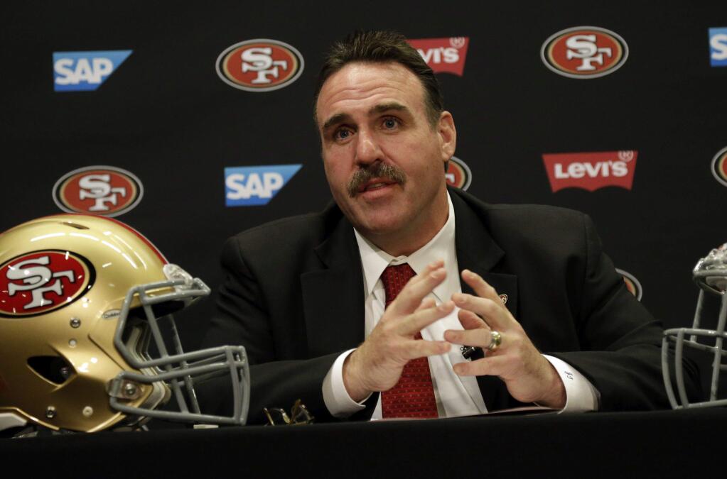 New 49ers coach Jim Tomsula will have a team of experienced NFL assistants on his staff. (Marcio Jose Sanchez / Associated Press)