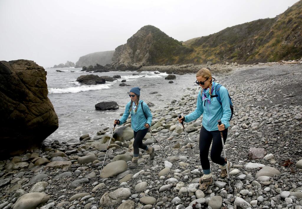 Morgan Visalli, right, and Jocelyn Enevoldsen walk along the California Coastal Trail near Reef Campground south of Fort Ross , on Tuesday, May 31, 2016. (BETH SCHLANKER/ The Press Democrat)